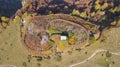 Autumn warm colors. Camouflaged hunting cabin surrounded by trees and hedges