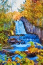 Autumn Waterfall in Michigan with Vibrant Foliage and Motion Blur Effect