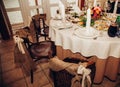 Autumn wedding decor in rustic style on the chairs of guests in the restaurant at a festive banquet Royalty Free Stock Photo