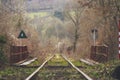 Autumn or winter abandoned train track in the forest over a bridge Royalty Free Stock Photo