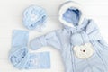 Autumn or winter fashion outfit. Baby boy blue set of clothing on the white background Royalty Free Stock Photo