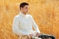 Autumn winter man portrait in outdoor dried grass Royalty Free Stock Photo