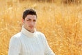 Autumn winter man portrait in outdoor dried grass Royalty Free Stock Photo