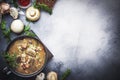 Autumn or winter meat vegetable mushroom hot soup with beef and wholegrain barley. With black breaÃÂ² and parsley, top view, gray