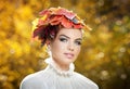 Autumn Woman. Beautiful creative makeup and hair style in outdoor shoot. Beauty Fashion Model Girl with Autumnal Make up and Hair Royalty Free Stock Photo