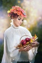 Autumn Woman. Beautiful creative makeup and hair style in outdoor shoot. Beauty Fashion Model Girl with Autumnal Make up and Hair Royalty Free Stock Photo