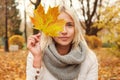 Autumn woman with fall leaf walking