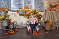 Autumn woman with autumn leaves. Cheerful young woman with autumn leafs. Girl wearing a wreath of yellow wilted leaves on her Royalty Free Stock Photo