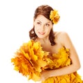 Autumn woman in yellow dress of maple leaves Royalty Free Stock Photo