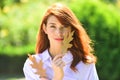 Autumn woman with yellow leaves. Portrait of young woman with autumn leafs in front of foliage. Royalty Free Stock Photo