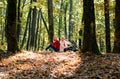 Autumn women talking on mobile phone in fall. Two serious girls having smartphone conversation.