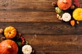 Autumn wooden background with pumpkins, fall leaves, berries. Thanksgiving, Halloween, Harvest concept. Flat lay composition, top Royalty Free Stock Photo