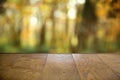 Autumn Wooden board empty table in front of blurred background . Empty wooden table in front of abstract blurred background of Royalty Free Stock Photo