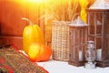 Autumn yellow leaves, pumpkins, autumn, straw, wooden door on the background. Garden composition, old zinc aged watering can and Royalty Free Stock Photo