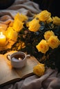 Autumn yellow and orange fall leaves and book, hot cup of coffee