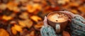 Autumnal Ambiance Enhanced By A Hand Holding A Warm Cup Of Coffee