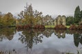 Autumnal colours and the large Oak tree at Scotney Castle in the UK