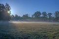 Autumnal dawn over rural meadows.