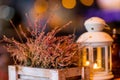 Autumnal decorated terrace.Seasonal home garden autumn decoration with heather flower.White lantern and heath plants in Royalty Free Stock Photo