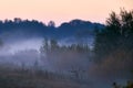 Autumnal foggy sunrise landscape