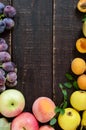 Autumnal food background. Crop of fruit on wooden background. Royalty Free Stock Photo