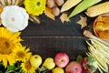 Autumnal food background. Crop of vegetables and fruit on wooden background Royalty Free Stock Photo