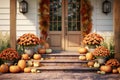 Autumnal front porch decor with pumpkins mums