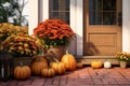 Autumnal front porch decor with pumpkins mums