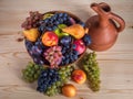 Autumnal fruit still life with Georgian jug on rustic wooden tab Royalty Free Stock Photo