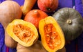 Harvest of ripened yellow, orange, green pumkins full and cut