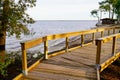 Autumnal lake view wooden path terrace in Maubuisson Carcans France