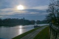 Vistula river and bike lane next to it in Krakow, Poland. Autumnal view in a cloudy day. Royalty Free Stock Photo