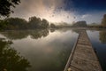 Autumnal landscape with pond and fog Royalty Free Stock Photo