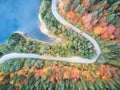 Autumnal landscape view of a mountain road and a lake Royalty Free Stock Photo