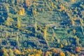 Autumnal mountain panoramic view over houses and nature. Beautiful sunny autumn landscape with houses, mountain village, rustic f