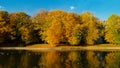 Autumnal park. Lake with reflection. Morning