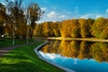 Autumnal park. Lake with reflection. Morning