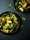 Autumnal plums and spinach salad with toasted walnuts, honey-lime dressing and mint leaves