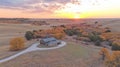 Autumnal ranch sunset over a rustic home nestled in a valley Royalty Free Stock Photo