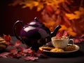 Autumnal Tea Time: Delicate Porcelain Teapot and Leaf-Shaped Cookies on a Rich Plum Canvas