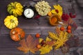 The Autumnal vegetables and leaves on dark wood Royalty Free Stock Photo