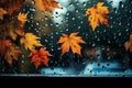 Autumnal window view rain meets colorful leaves, signifying the season