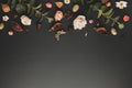 Autumnal-winter concept with dried flowers, branches of eucalyptus, leaves and berries on dark background. Frame of plants. Flat