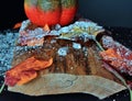 Autumnally decorated ice crystals with pumpkin,snow and autumn foliage