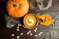 Autunm flat lay composition with pumpkin cream soup and fresh pumpkins Royalty Free Stock Photo