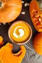 Autunm flat lay. Pumpkin soup in bowl and fresh pumpkins Royalty Free Stock Photo