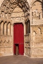 Red entrance door gothic cathedral church Auxerre