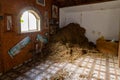 Auxiliary storage room for hay in the lower yard on exhibition in the Gardens Almona collection, in the rays of the setting sun,