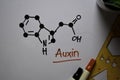 Auxin molecule write on the white board. Structural chemical formula. Education concept
