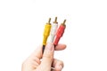 AV cable connectors in hand Royalty Free Stock Photo